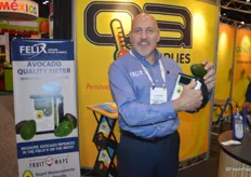 Leonard Felix proudly shows the company's new avocado meter that attracted many visitors to the booth.